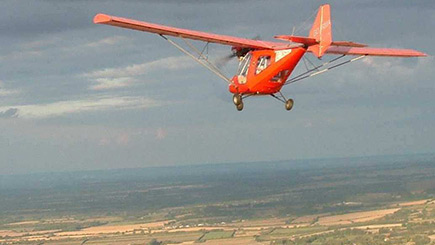 Extended Fixed Wing Microlight Flying In East Riding